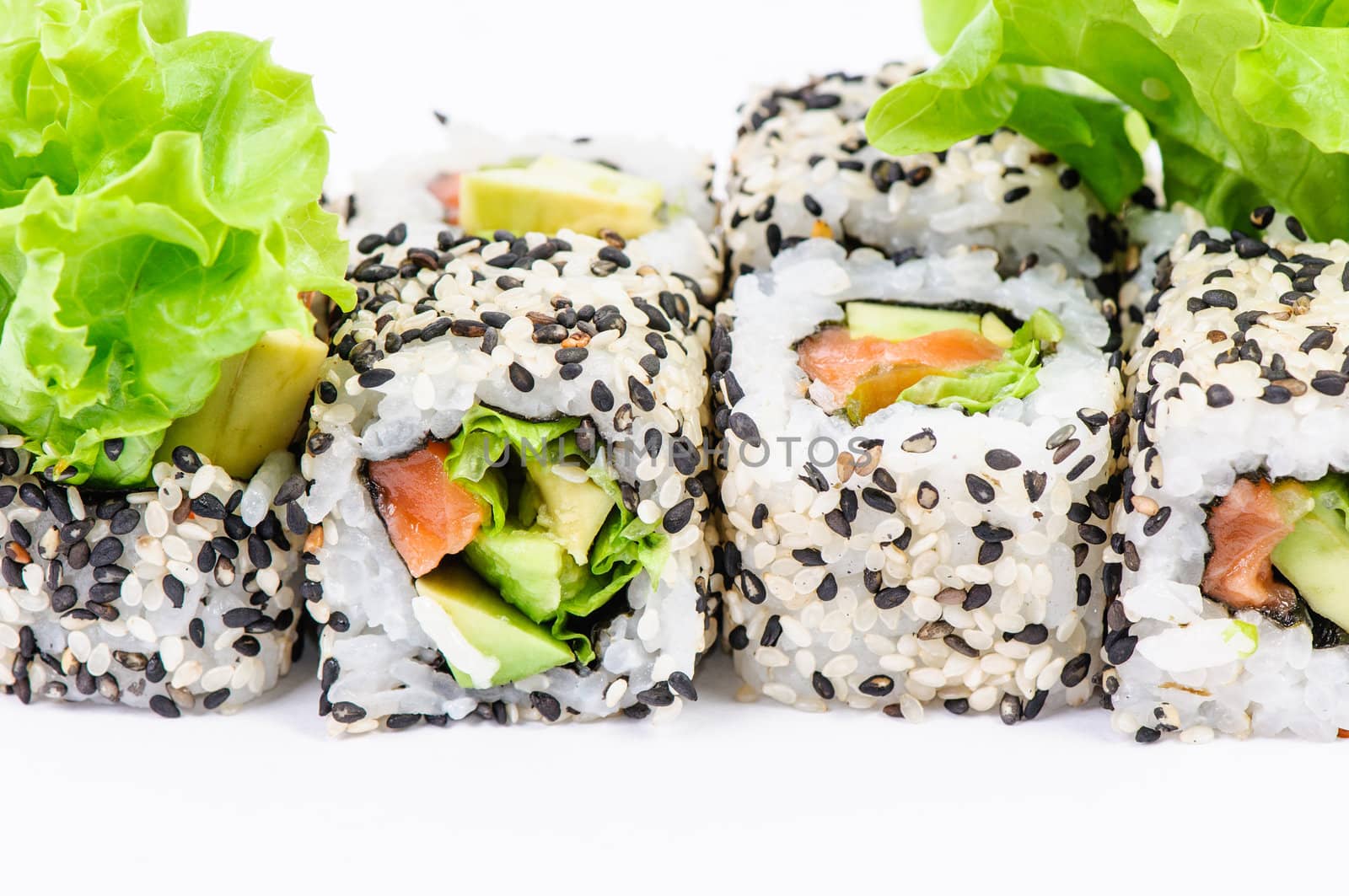 Sushi set with leawes salad on white background