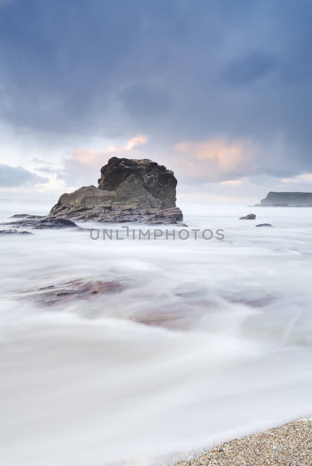 Cornish seascape shot in twilight. Motion blur in water.