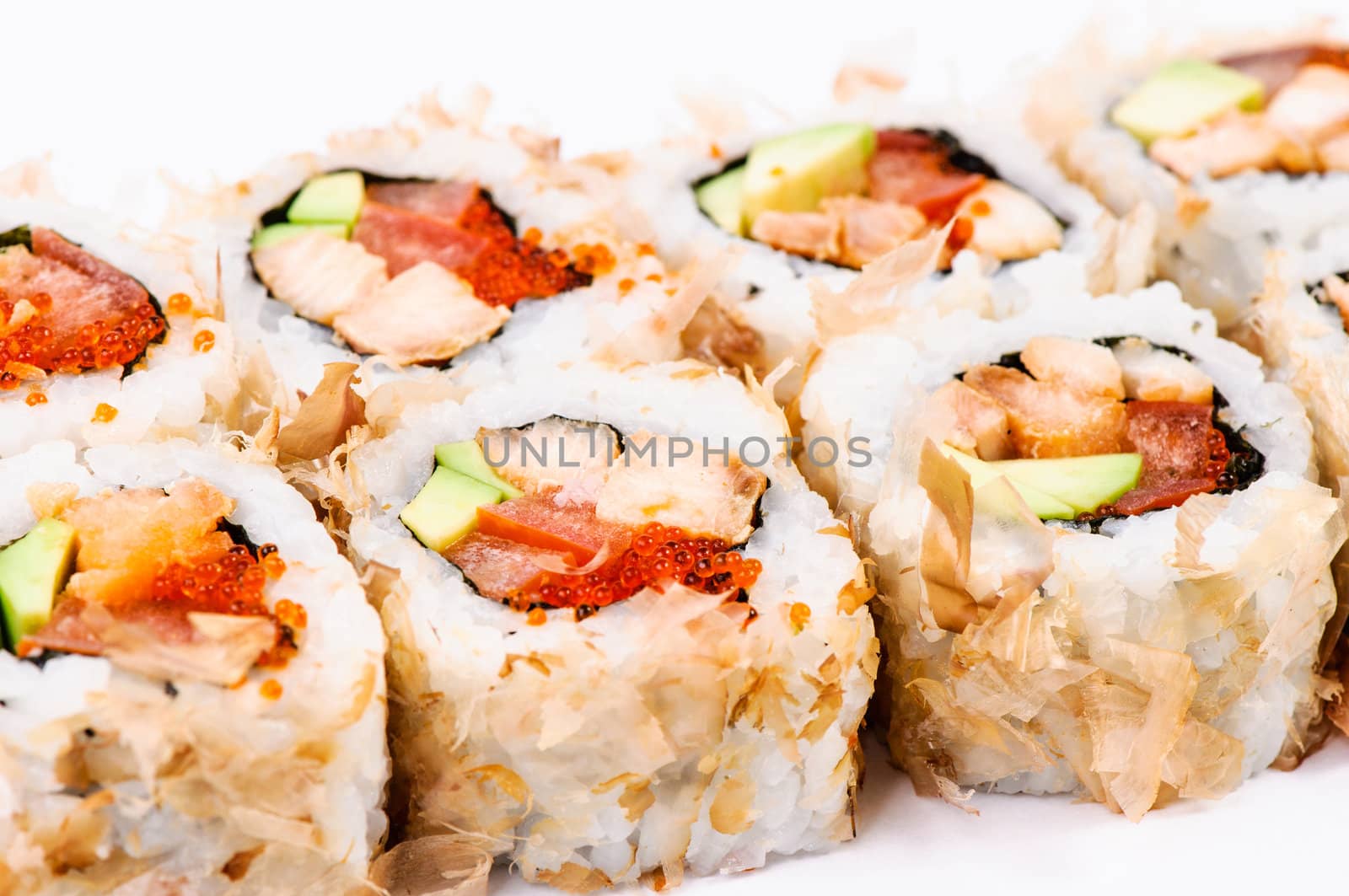 Sushi set with avocado, fish and red caviar on white background