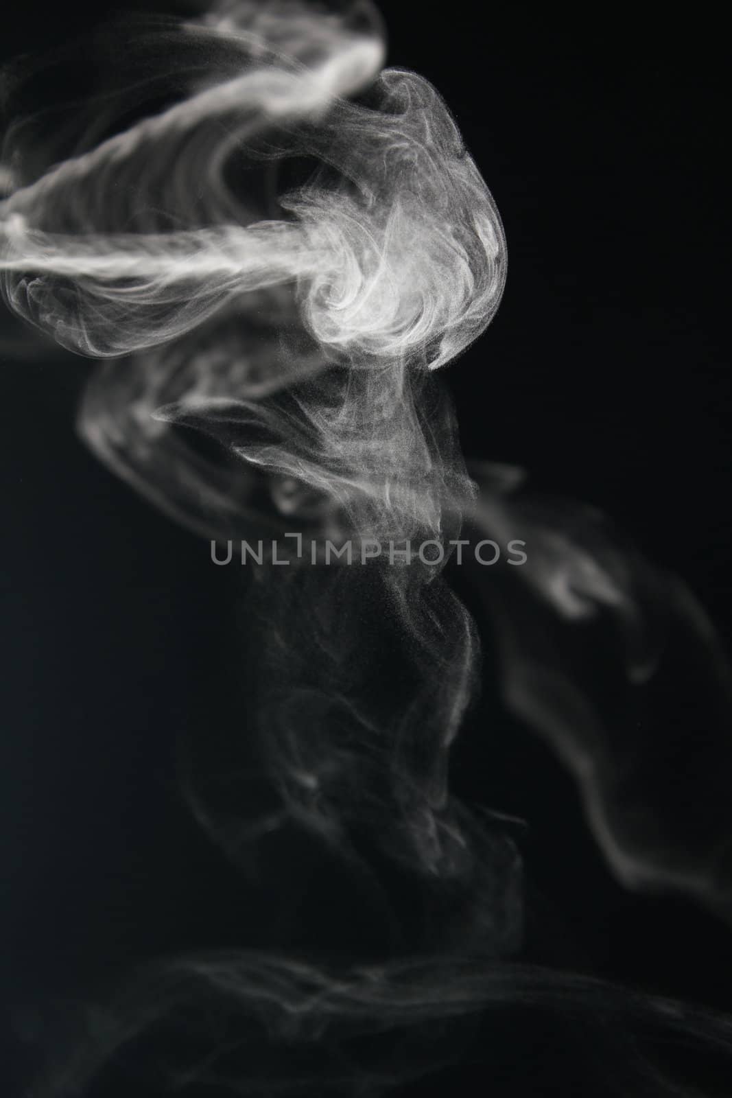 an abstract smoke picture in front of a black background