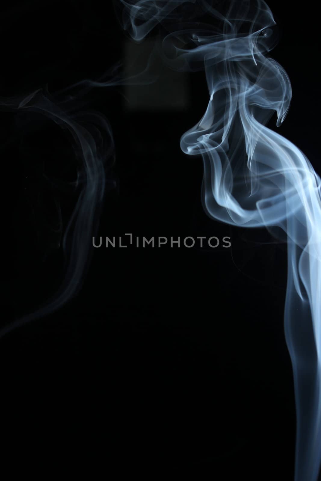 an abstract smoke picture in front of a black background