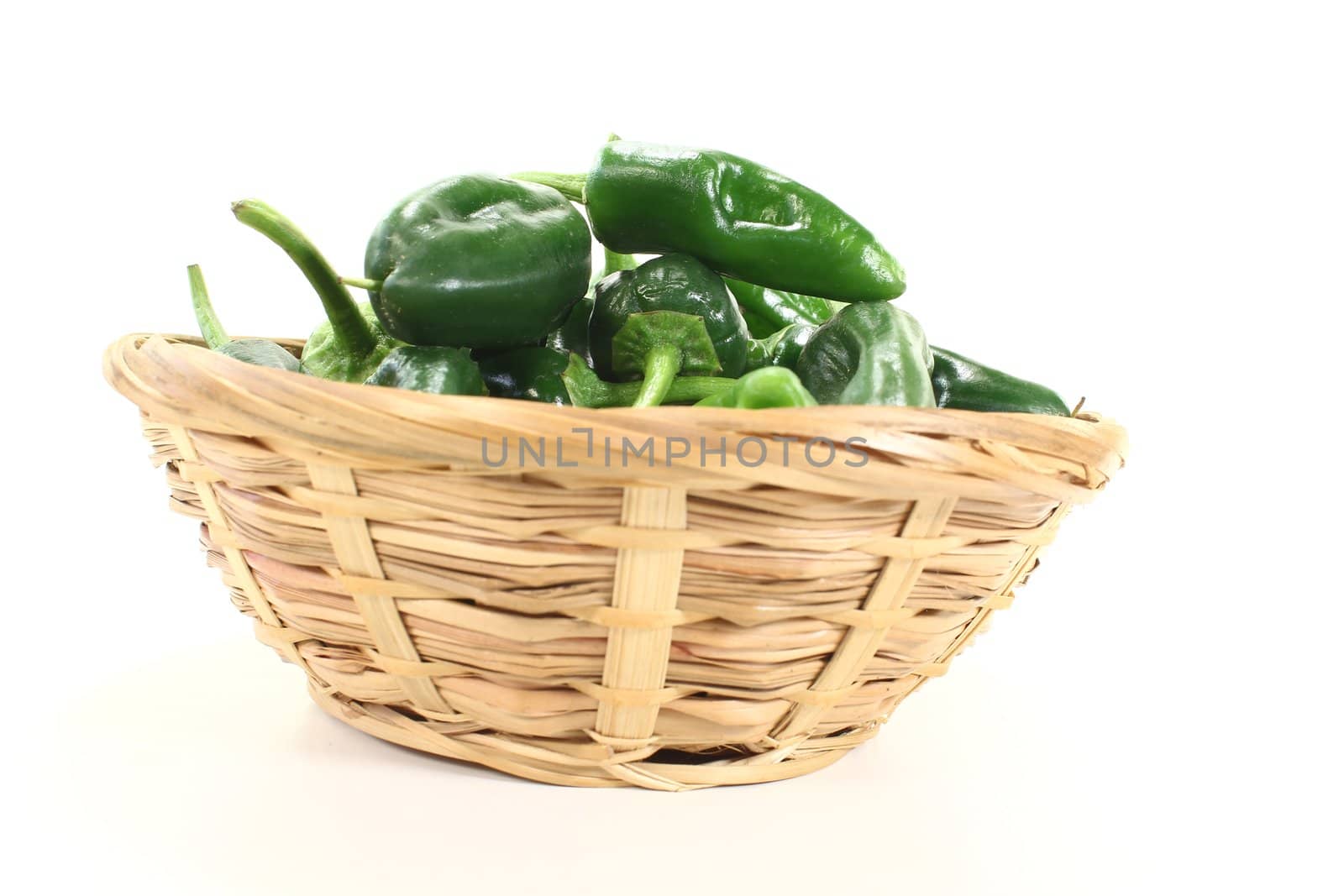 fresh Pimientos in a bowl on light background