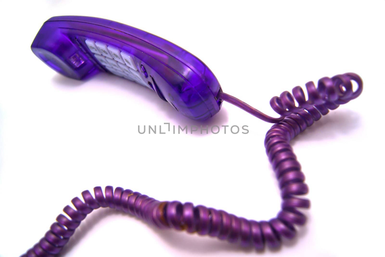 Purple handset with a wire on white