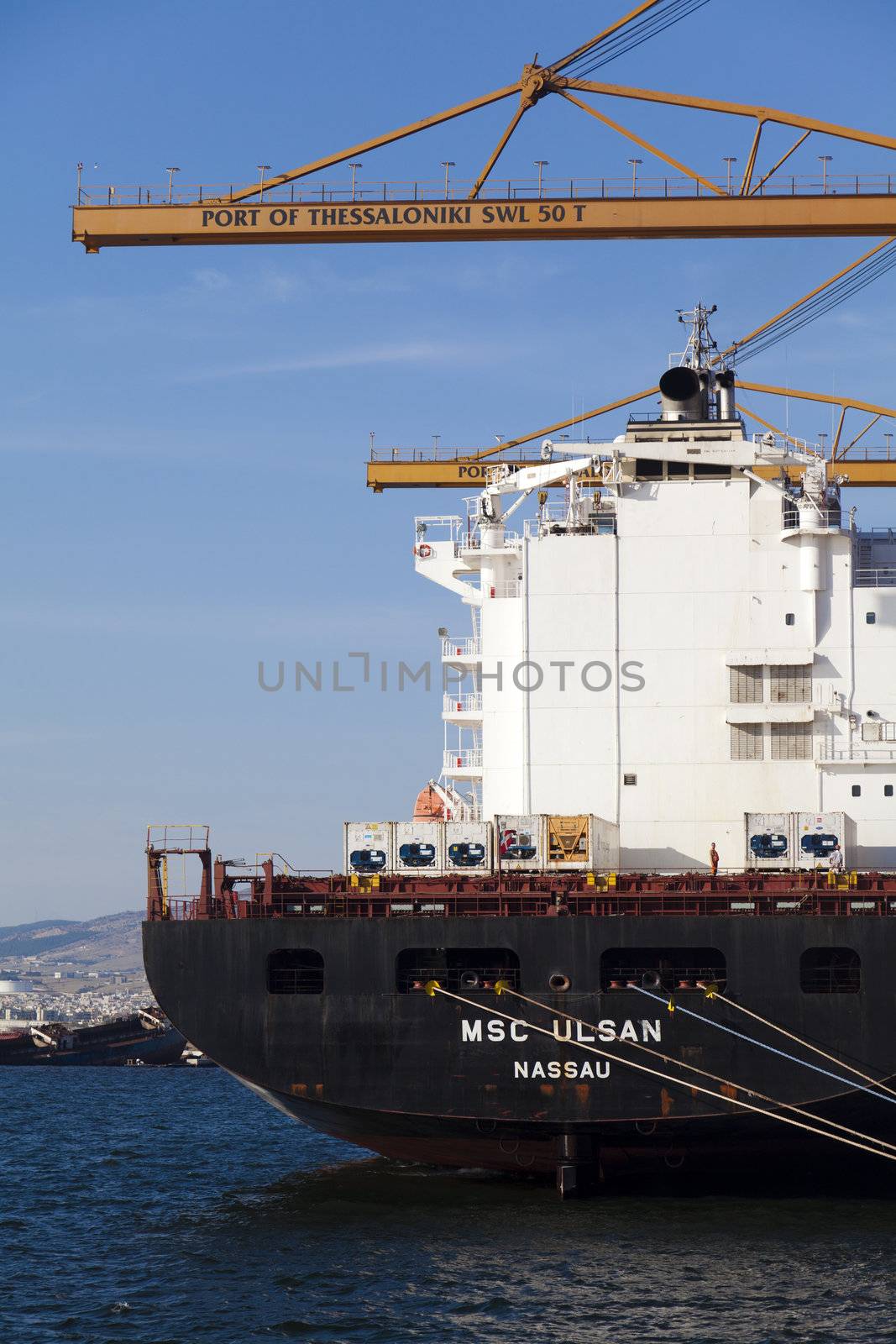 THESSALONIKI, GREECE - SEPTEMBER 29: Cranes load containers with products to ships in the port of Thessaloniki on September 29, 2011 in Thessaloniki, Greece