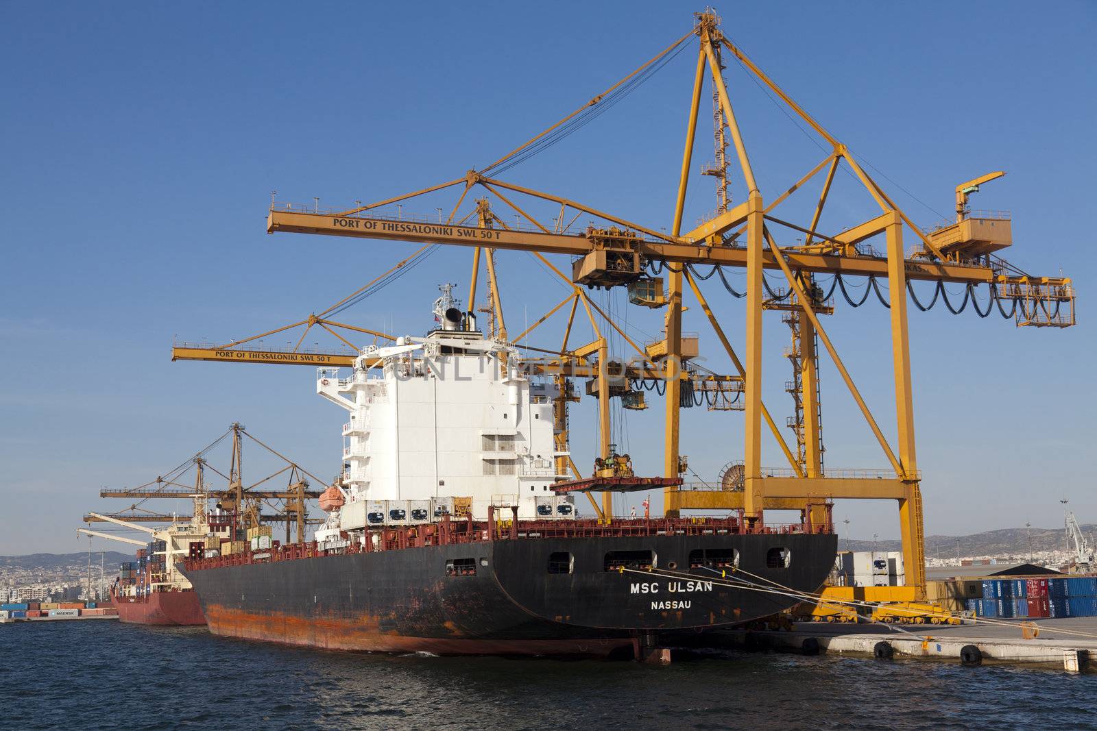 THESSALONIKI, GREECE - SEPTEMBER 29: Cranes load containers with products to ships in the port of Thessaloniki on September 29, 2011 in Thessaloniki, Greece