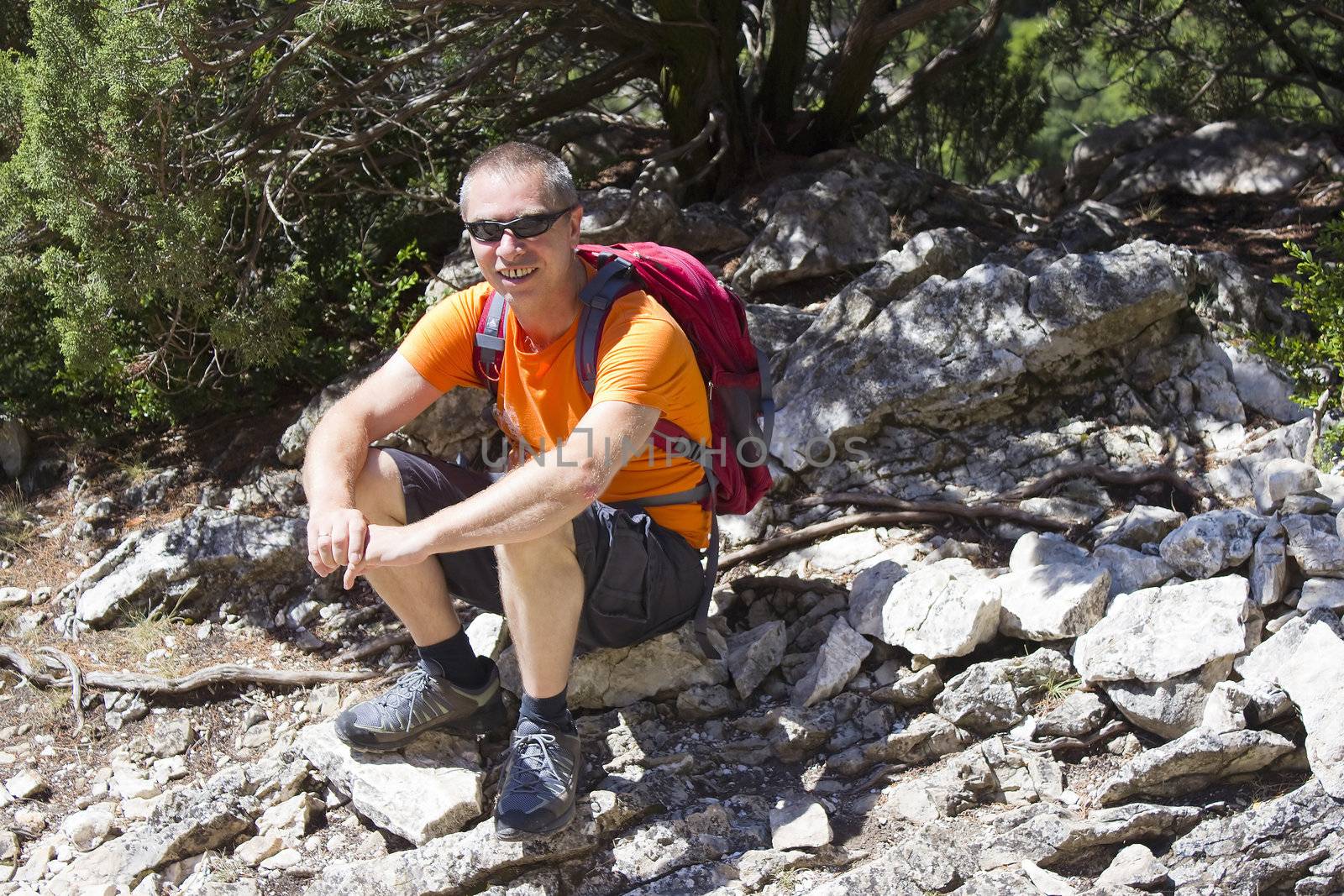 a man on the mountain trek  by miradrozdowski