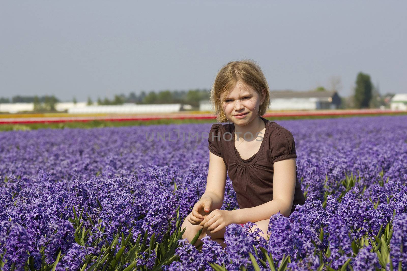 little girl in the hyacinth flowers