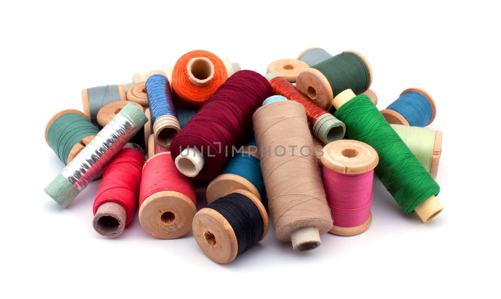 Set of colorful spools of thread isolated on white background