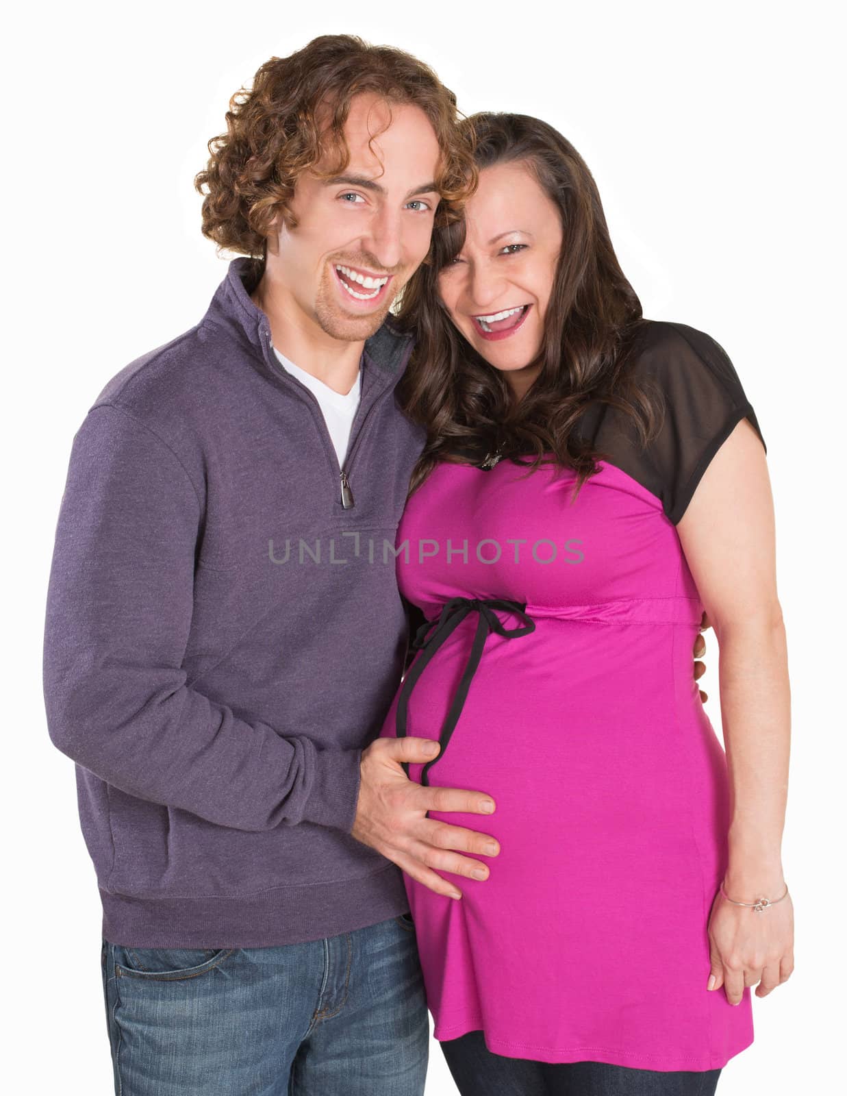 Cute laughing wife and husband expecting baby
