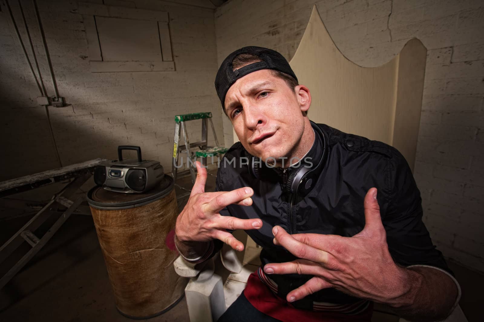 Urban musician with crossed fingers and goofy expression