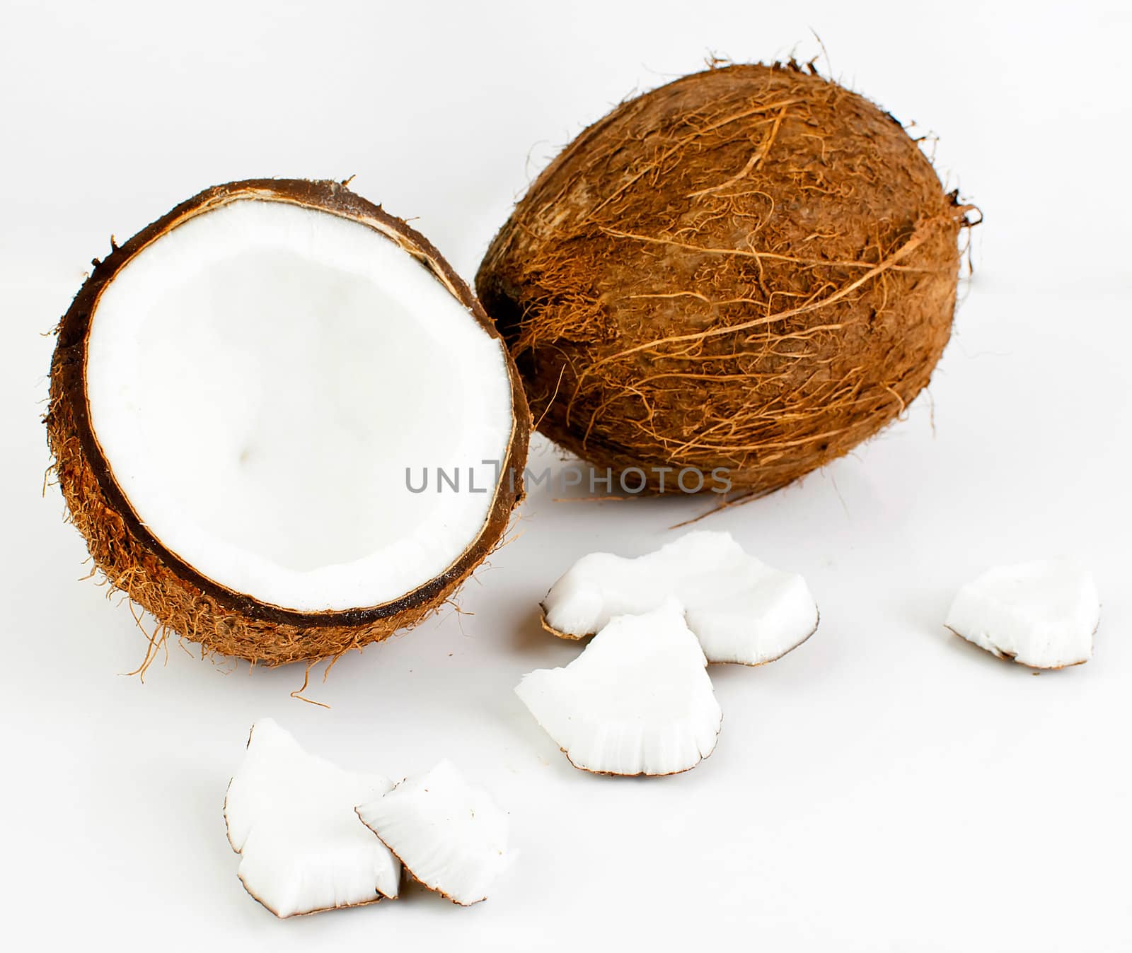freshly cut coconut and milk isolated on white background