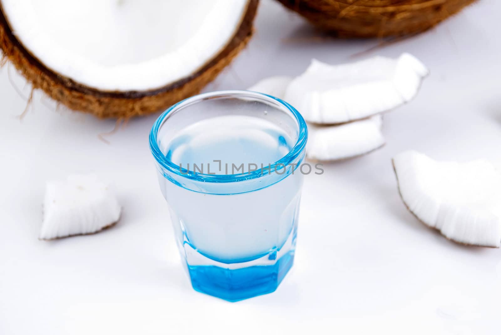 freshly cut coconut and milk isolated on white background