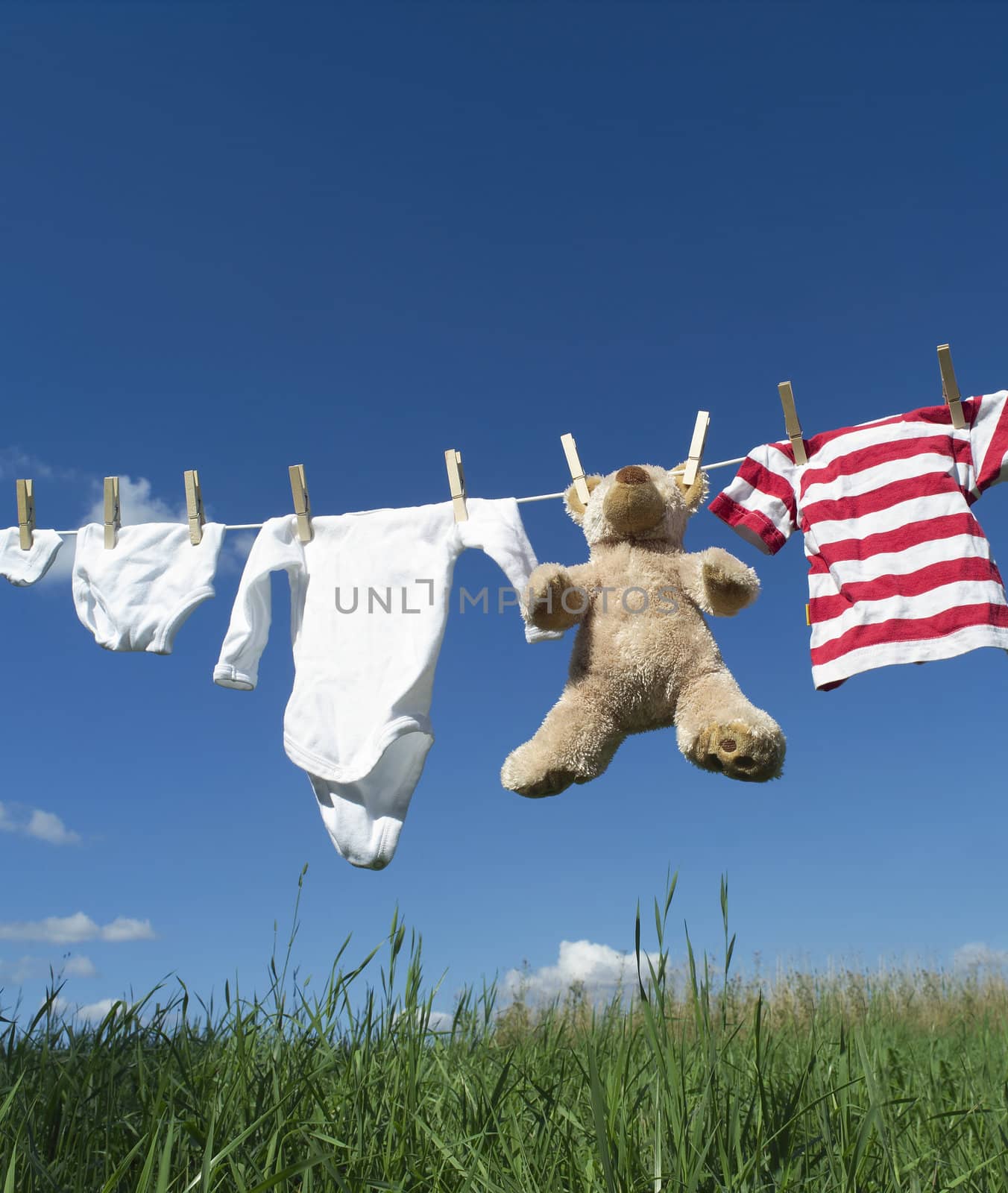 Baby clothing on a clothesline by gemenacom