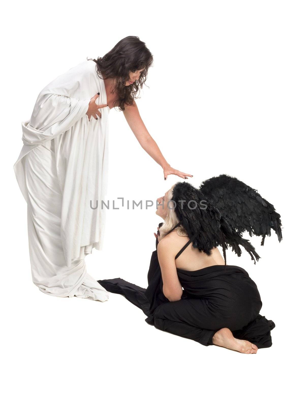 Two girls representing scene between angel and devil