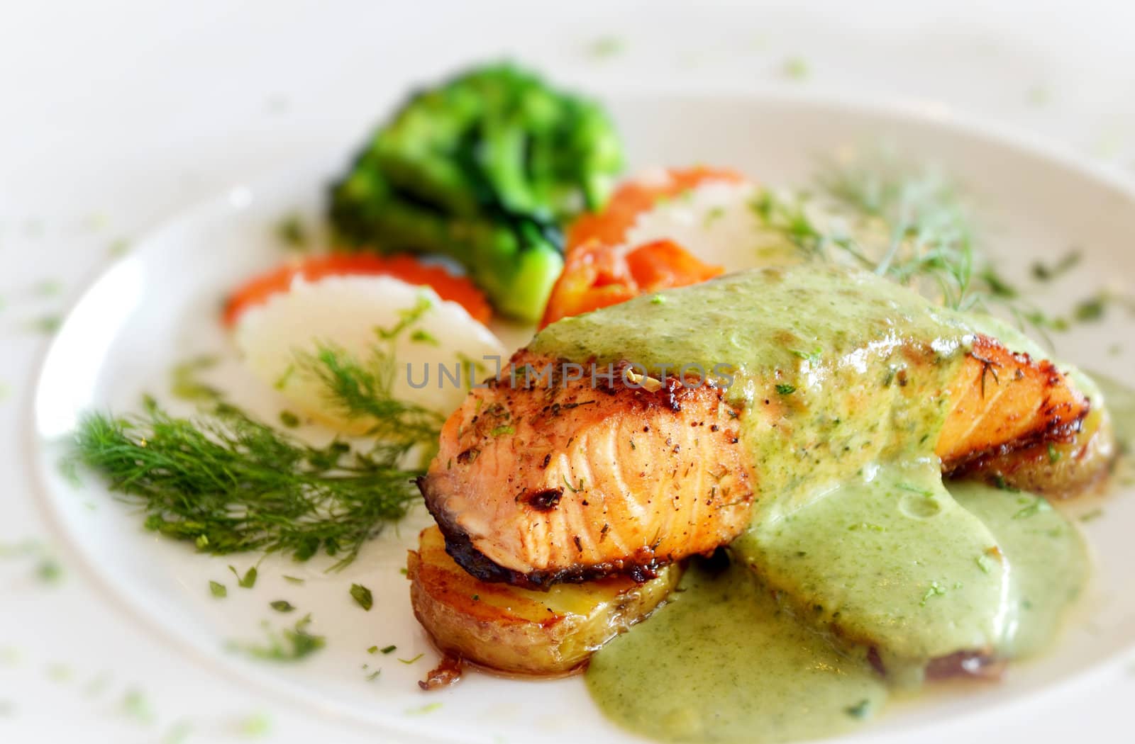 roasted salmon served with green sauce