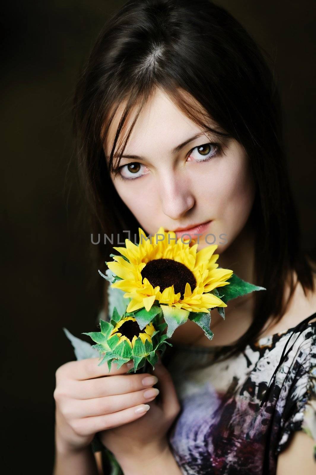 An image of a beautiful woman with sunflower
