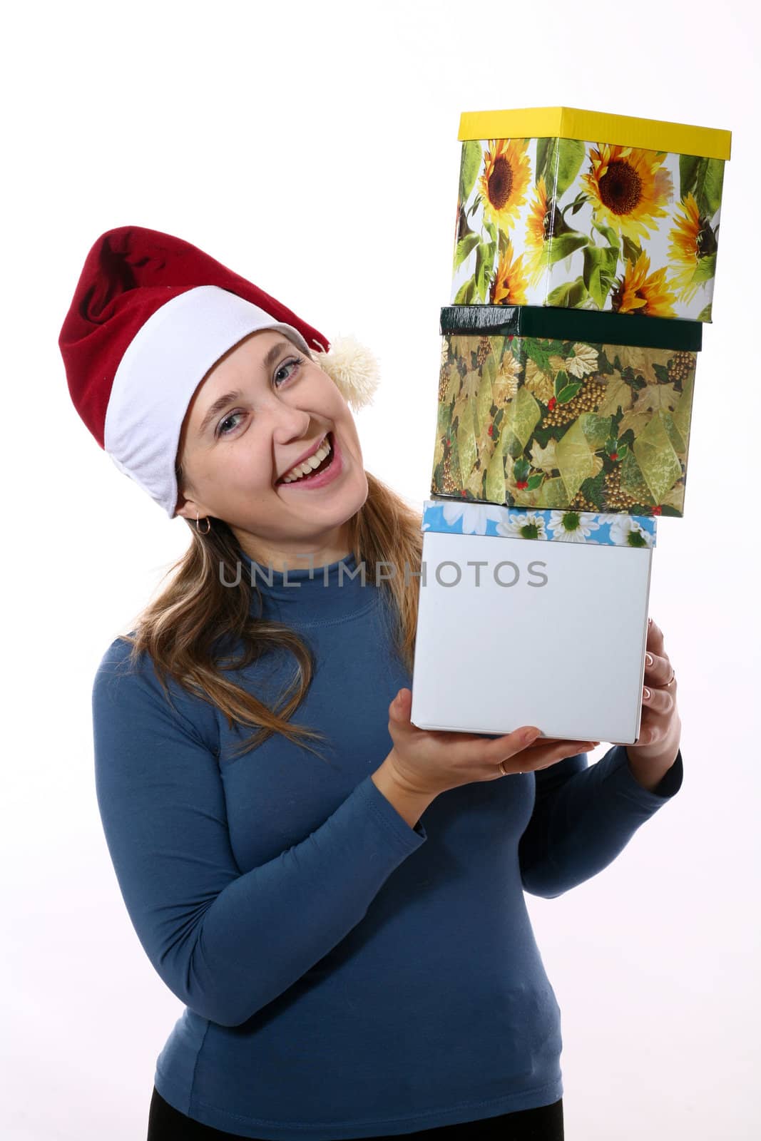 A gay girl in a new year cap with three boxes