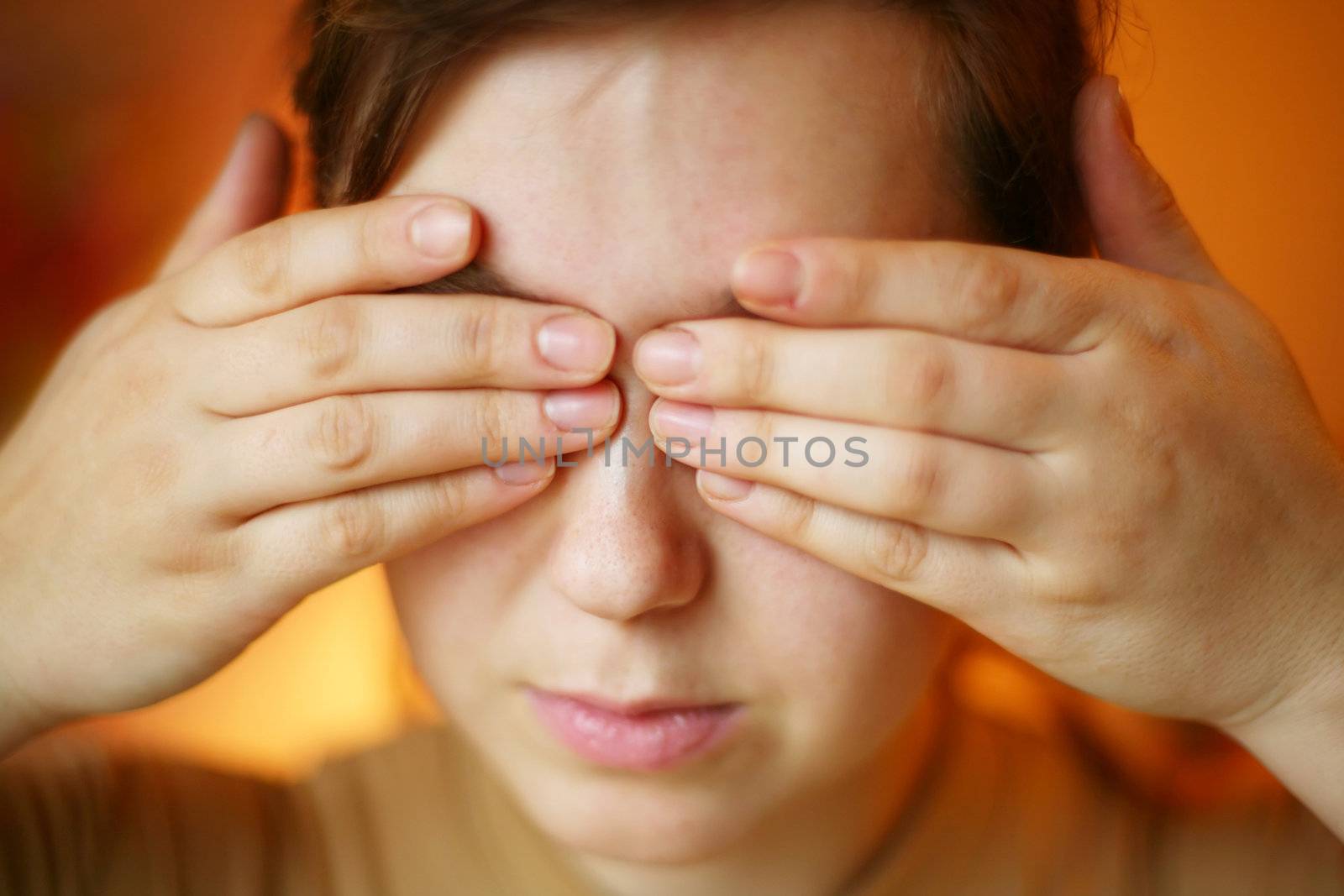 A woman with her hands on her face