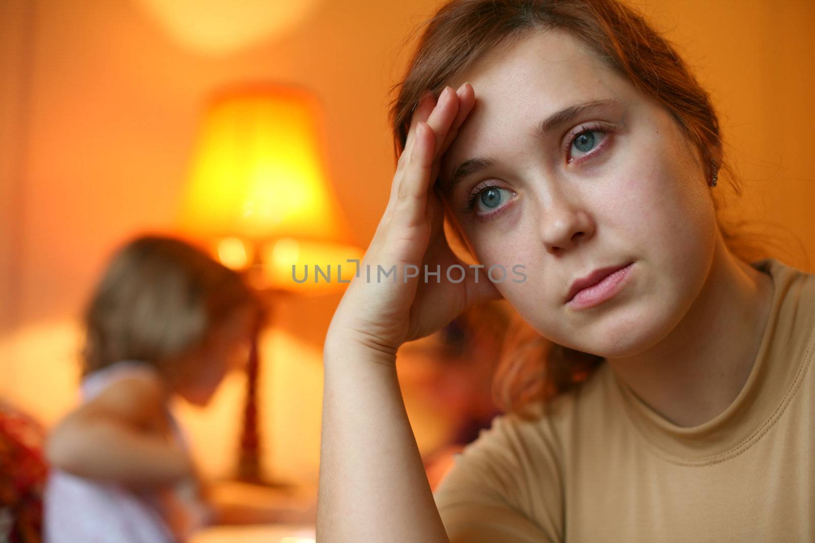 An image of a tired woman and a child