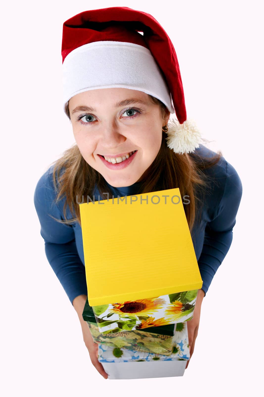 A girl in a new year cap with a yellow box