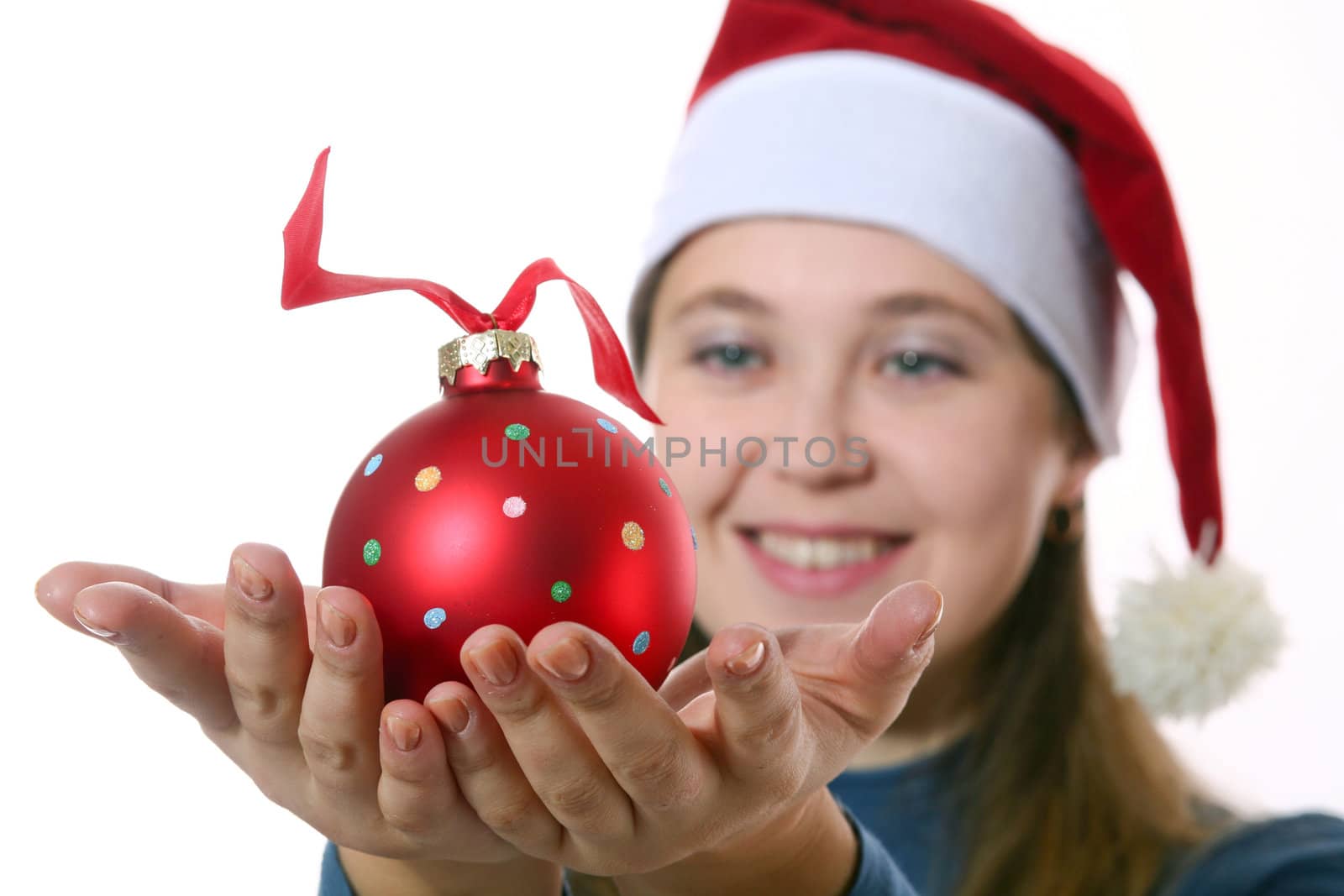 An image of a girl in a cap with a ball