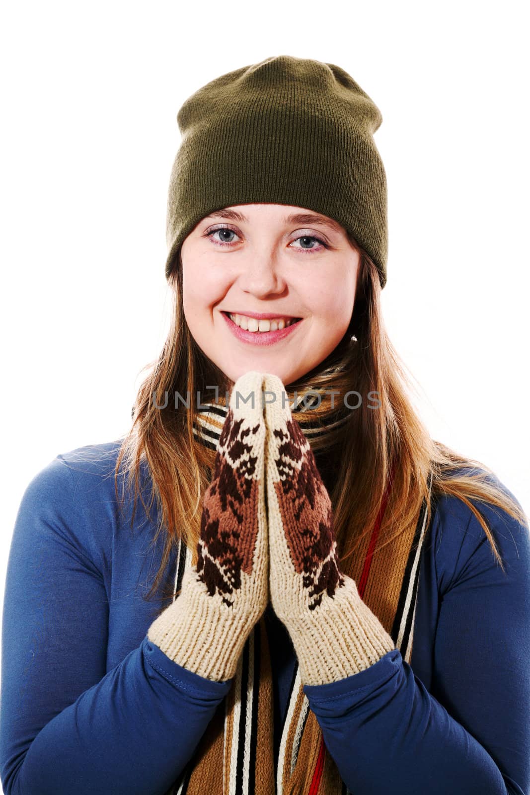 An image of a smiling girl with mittens