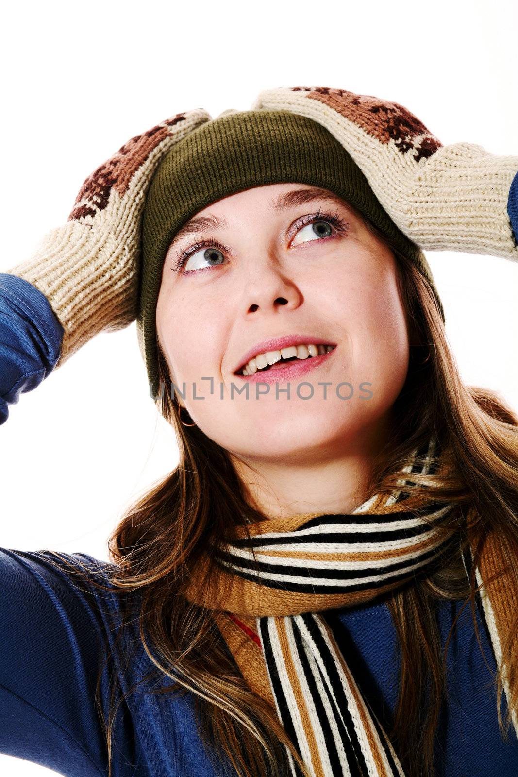 An image of a smiling girl in mittens
