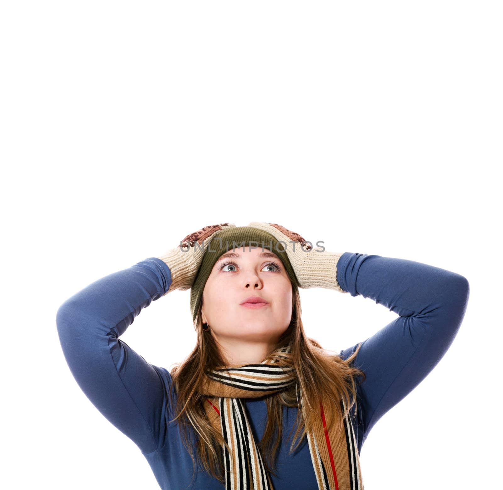 An image of a girl in a green hat, a scarf,mittens