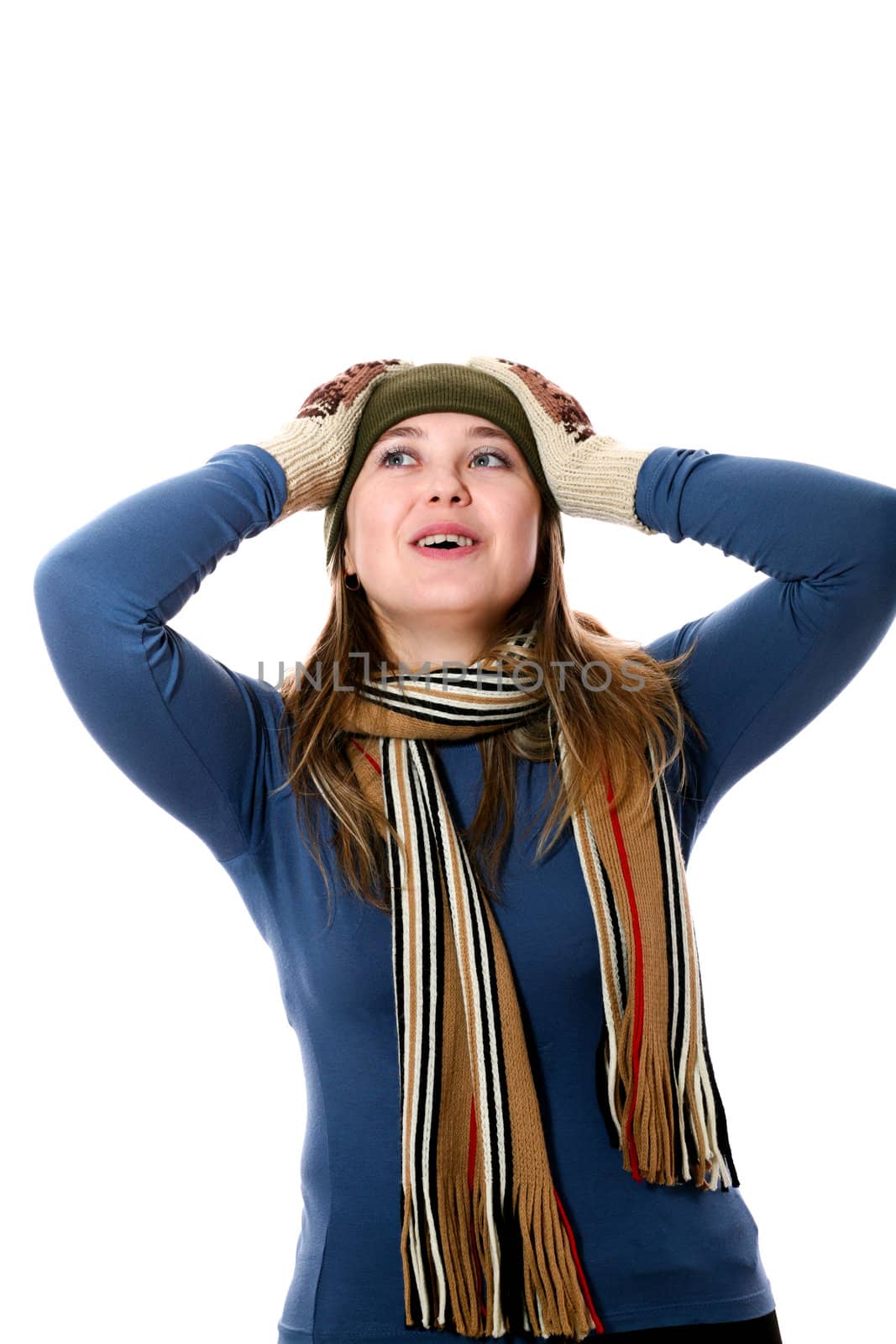 An image of a girl in a green hat and scarf
