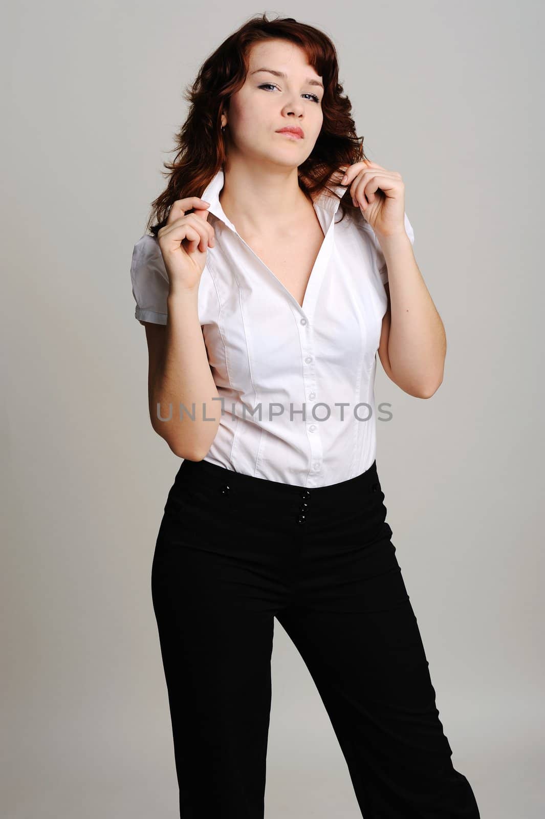 An image of young beautiful woman in white blouse