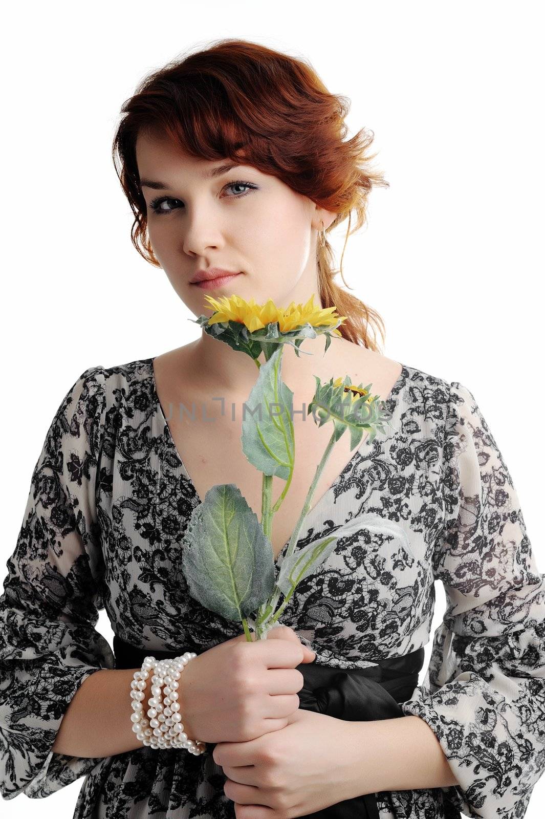 An image of young woman with yellow flower