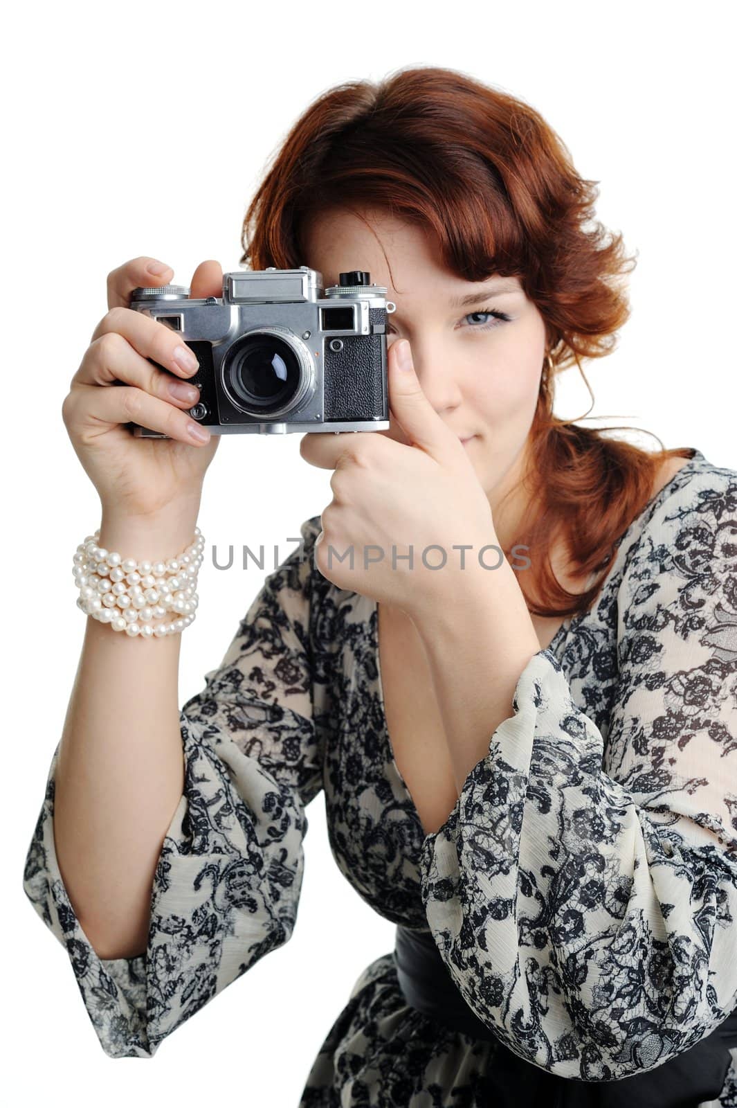 An image of a woman with a camera in her hands