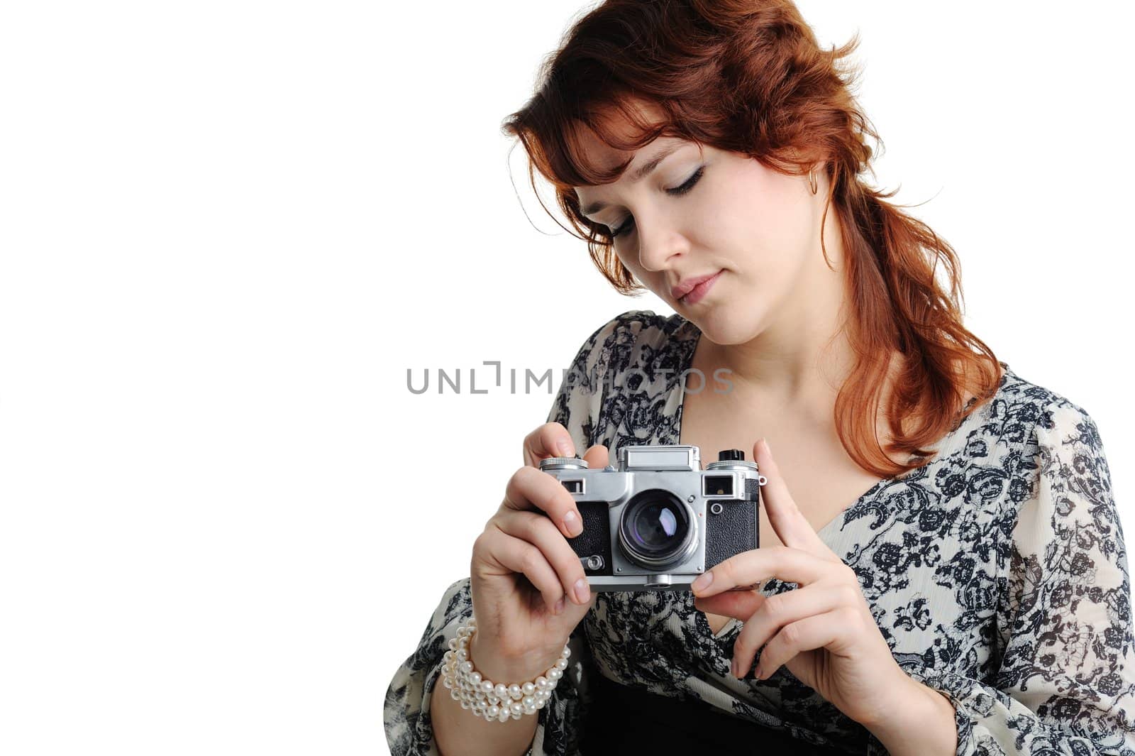 An image of a woman with a camera in her hands