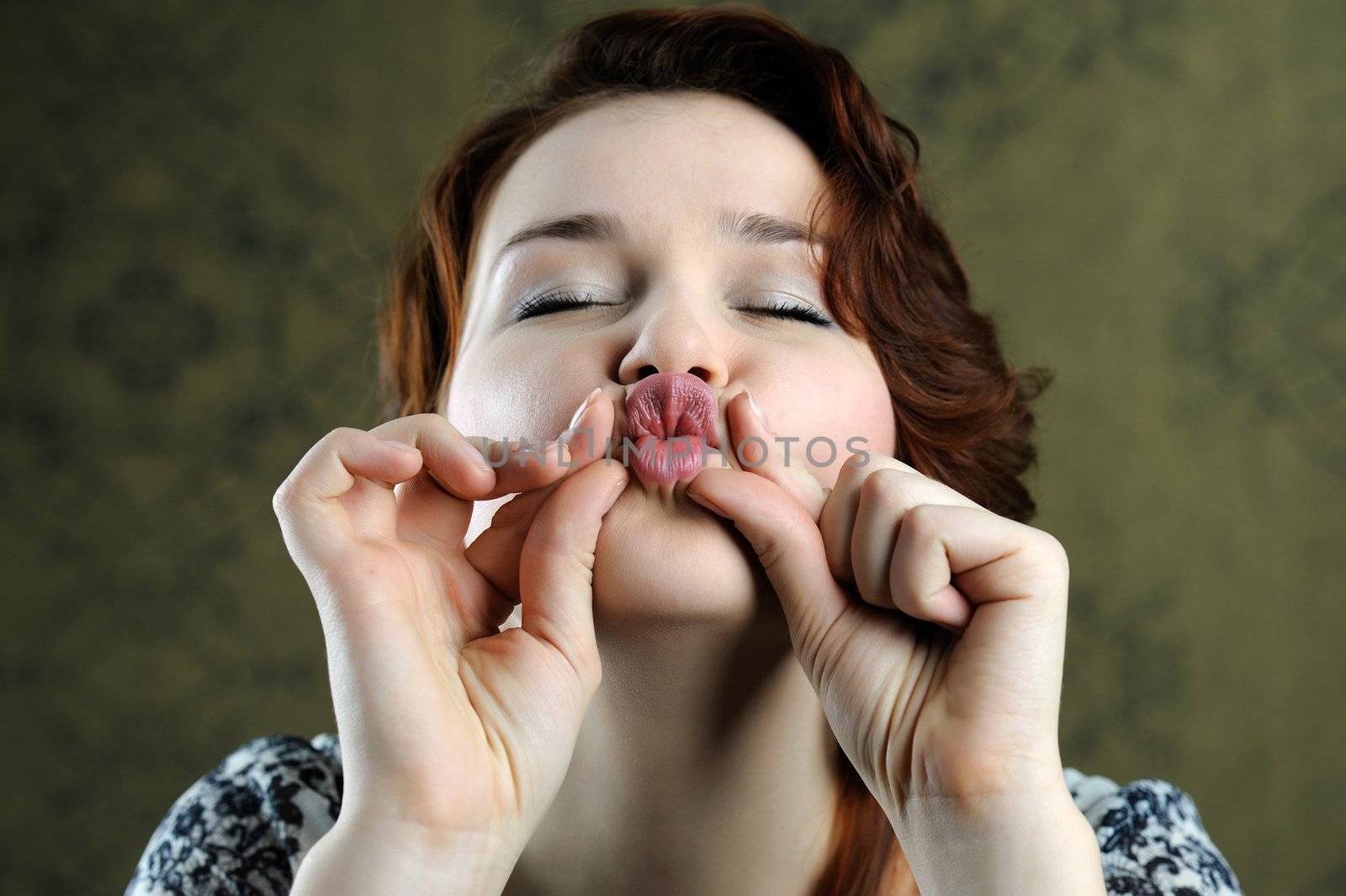 An image of a beautiful young woman posing