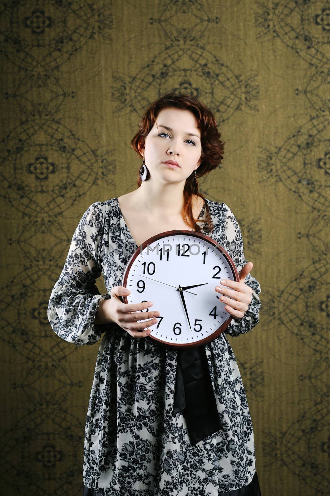 An image of a woman with a big clock