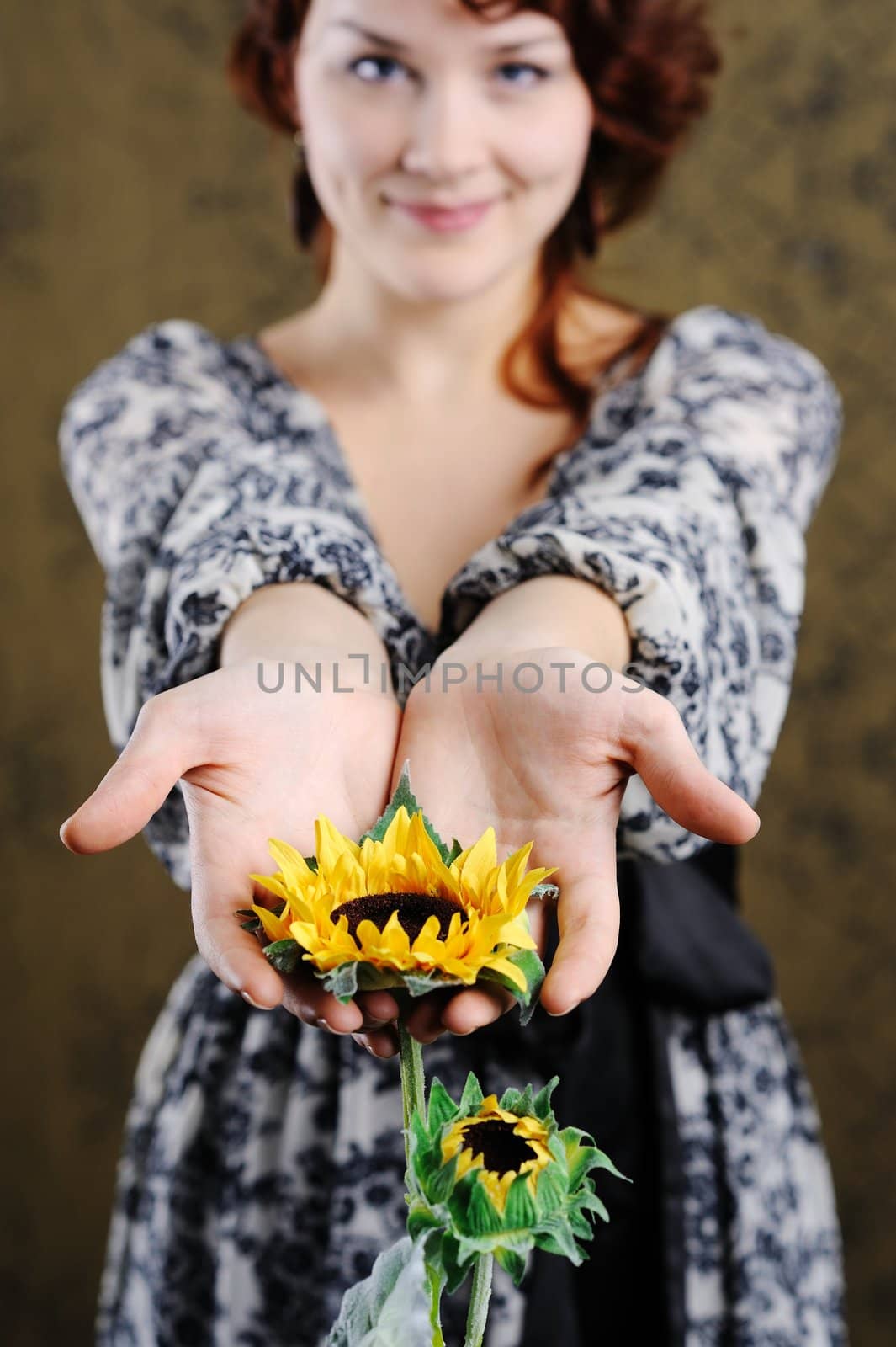 Young woman with sunflower by velkol