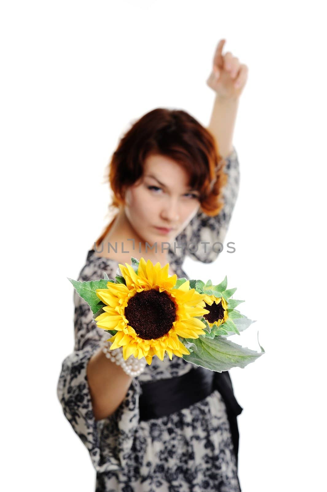 An image of young woman with yellow flower