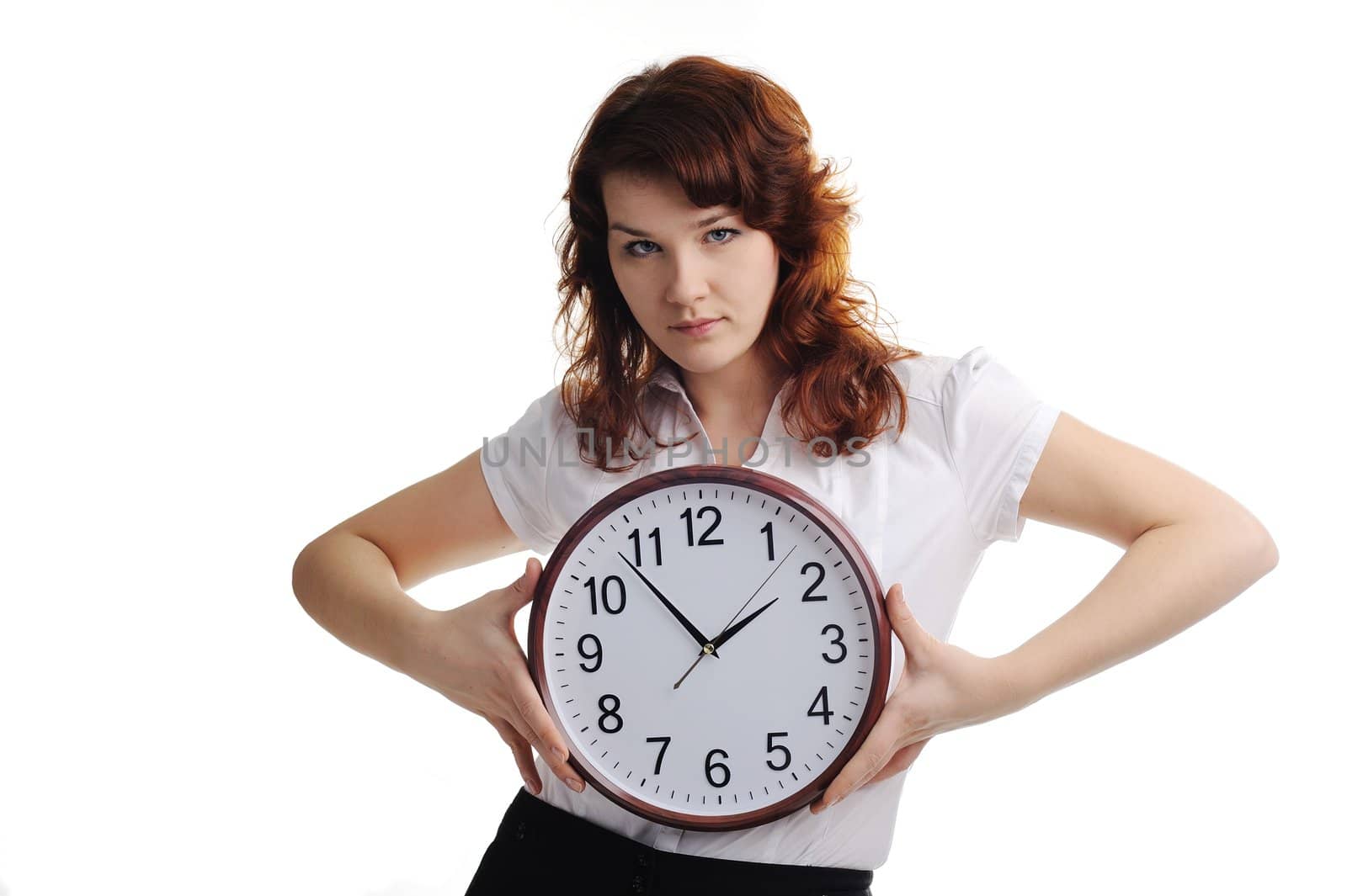 An image of a young woman with a clock