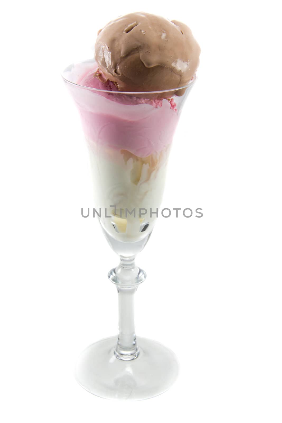 Picture of three different sort of icecream flavours in a wine glass