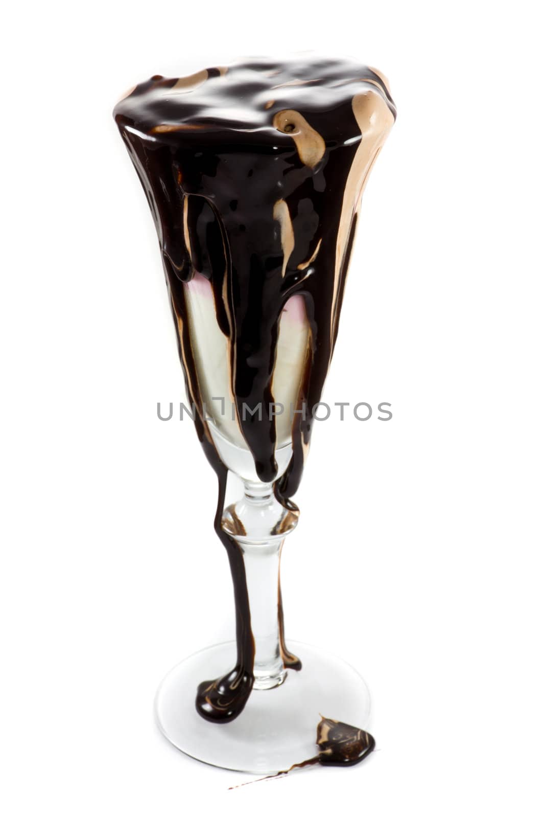 Icecream in a wine glass with massive amounts of chocolate topping