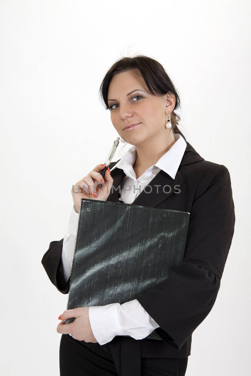 Business woman standing with folder and pen.