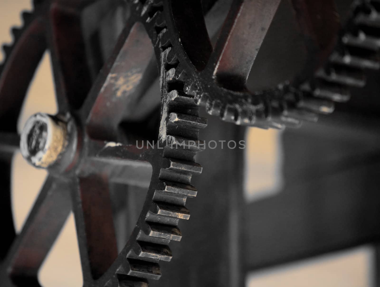 The mechanism of gear wheels, fragment of an antique printing press, close-up