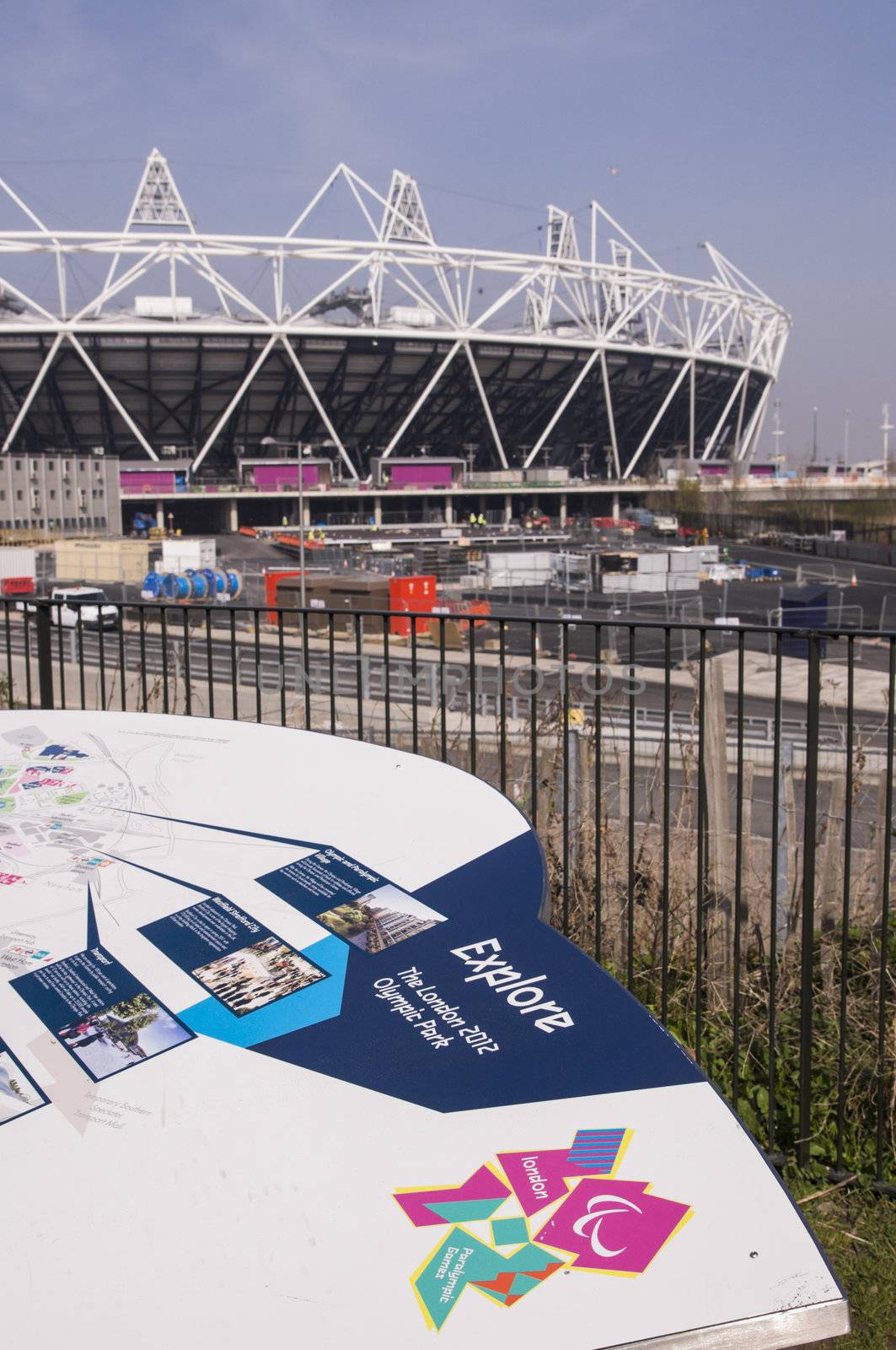 LONDON, UK – MARCH 24: Details of information board with London Olympics logo and Olympic Stadium in the background on March 24, 2012 in London. The Olympic Park is due to be ready in summer for the games.