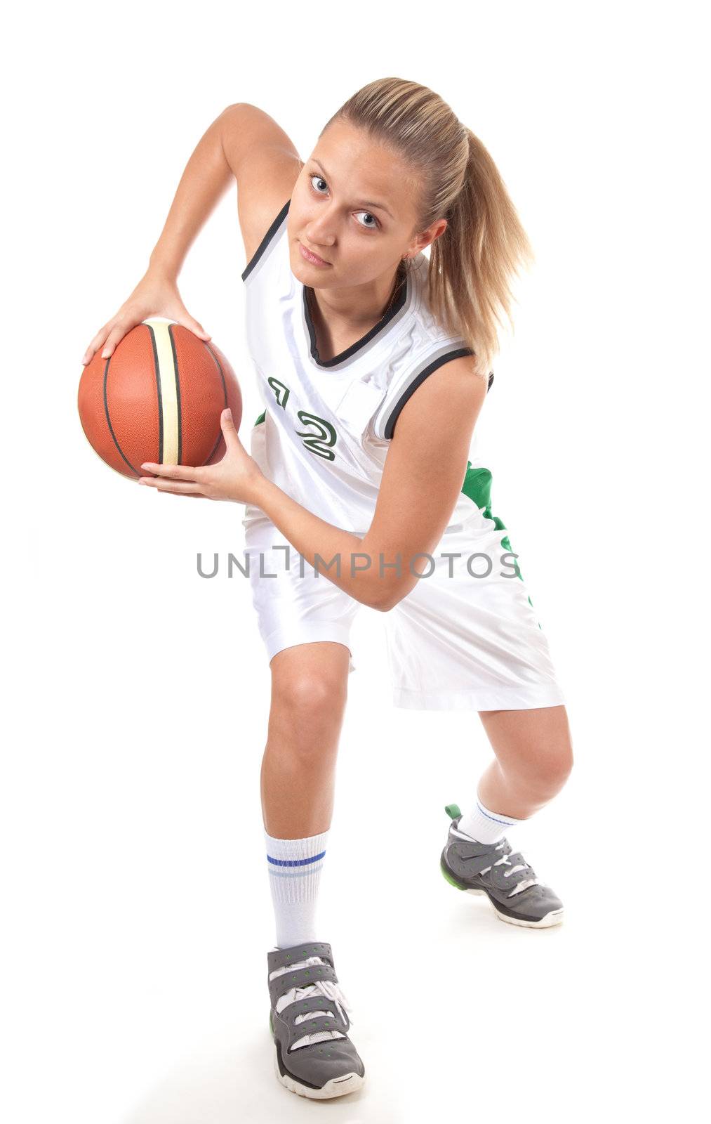 Young basketball player in action, isolated on white background 