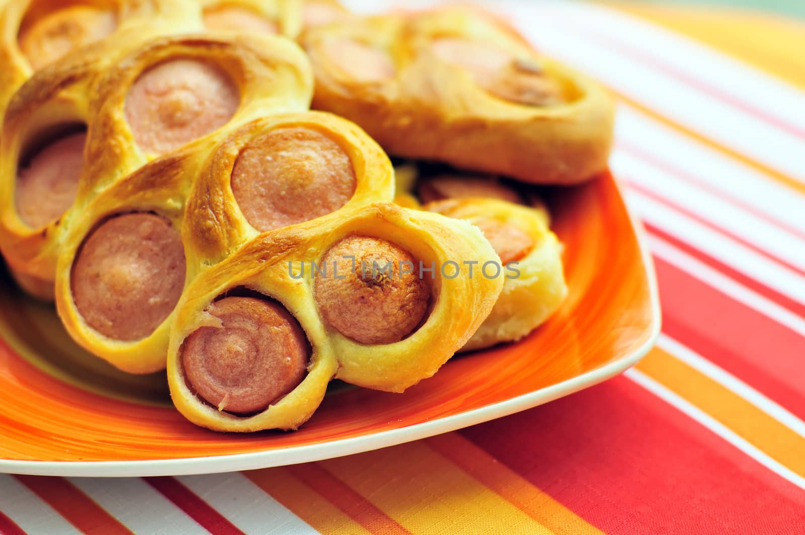 pieces of sausages baked in the dough 