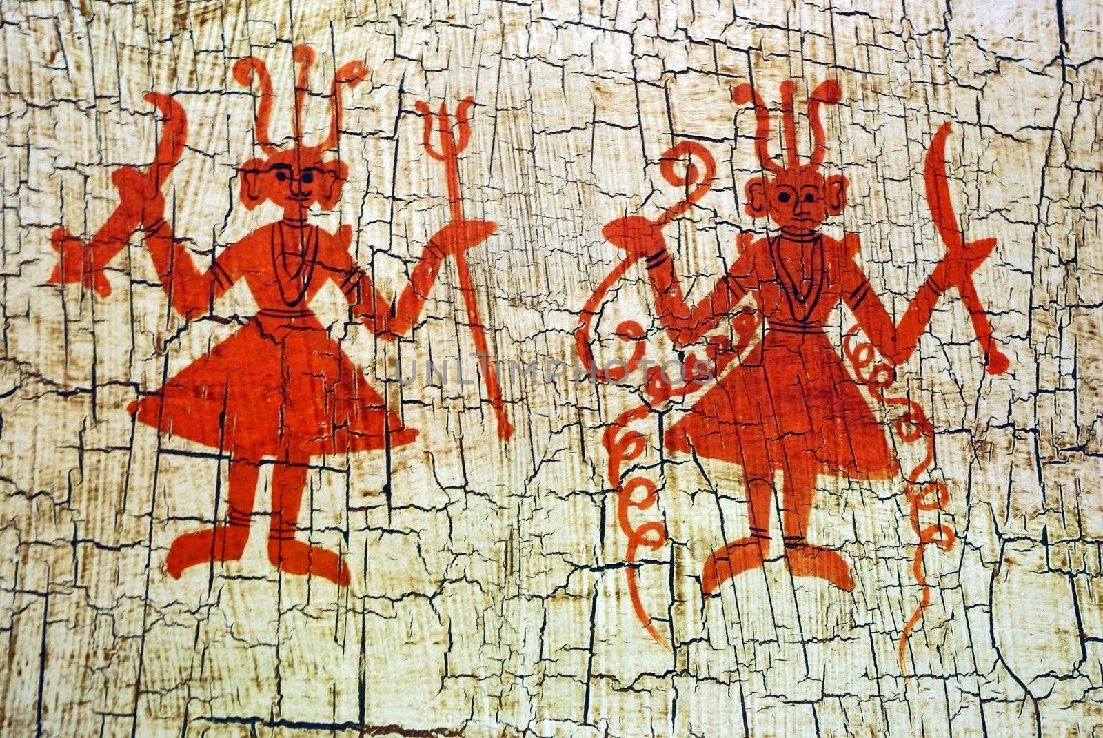 Dancing figures on an aged background. Ethnic indian art.