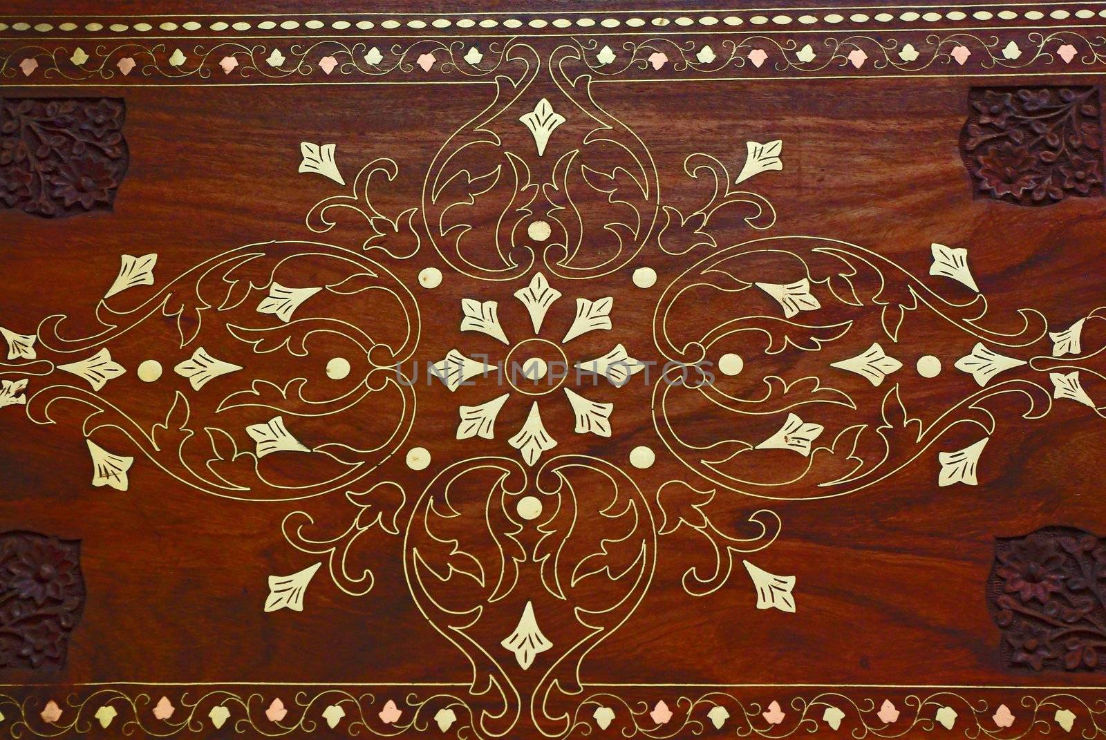 Wooden background with floral ornamental pattern and metall elements