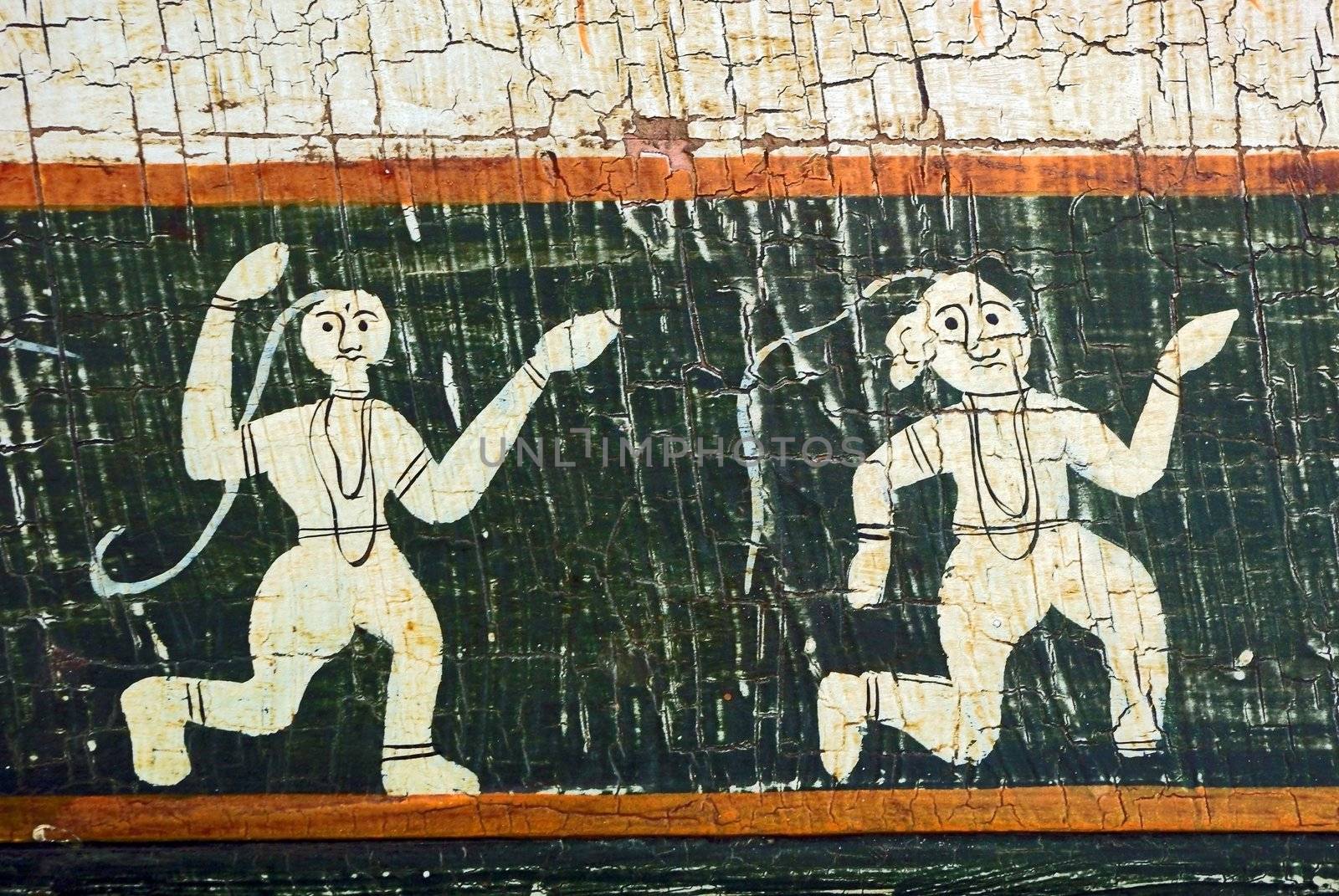 Dancing figures on an aged background. Ethnic indian art.