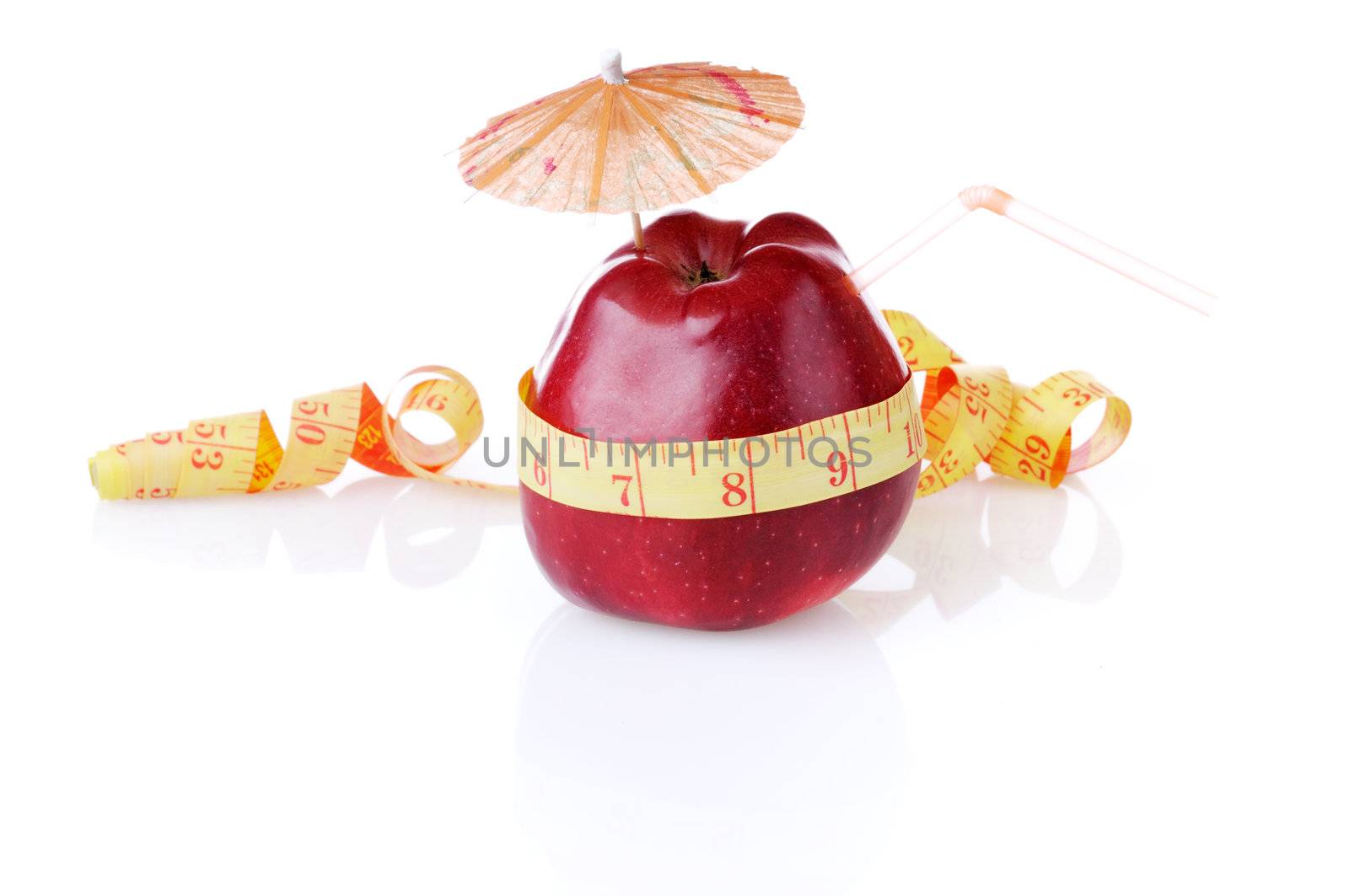 Red apple with umbrella and tube is measured by tape