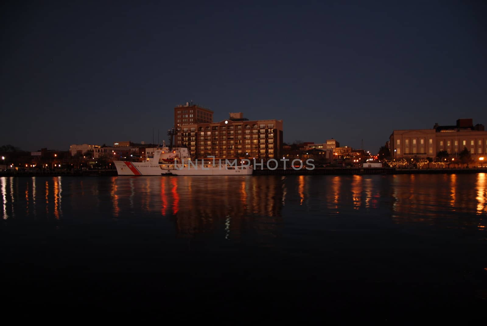 View along the river at night in Wilmington. The coast gaurd cutter is in dock.